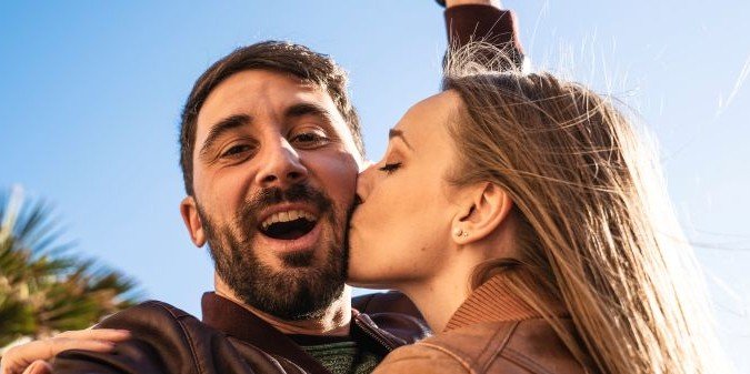 Young couple having fun taking a selfie portrait
