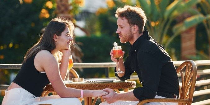 Happy young couple is together on their vacation Outdoors at sunny daytime