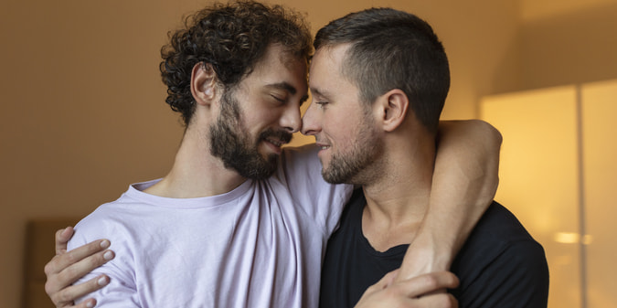 gay couple living with HIV discussing relationships